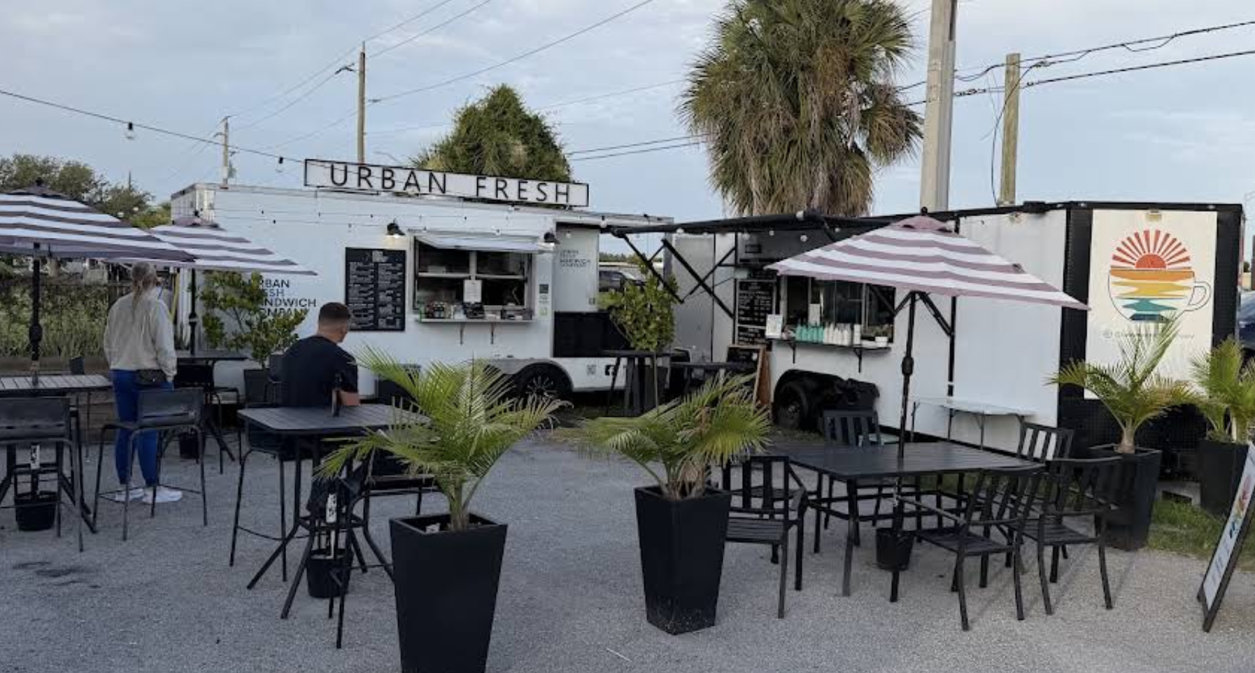 Urban Fresh Sandwich Company food truck and shaded outdoor seating on Cattlemen Road in Sarasota